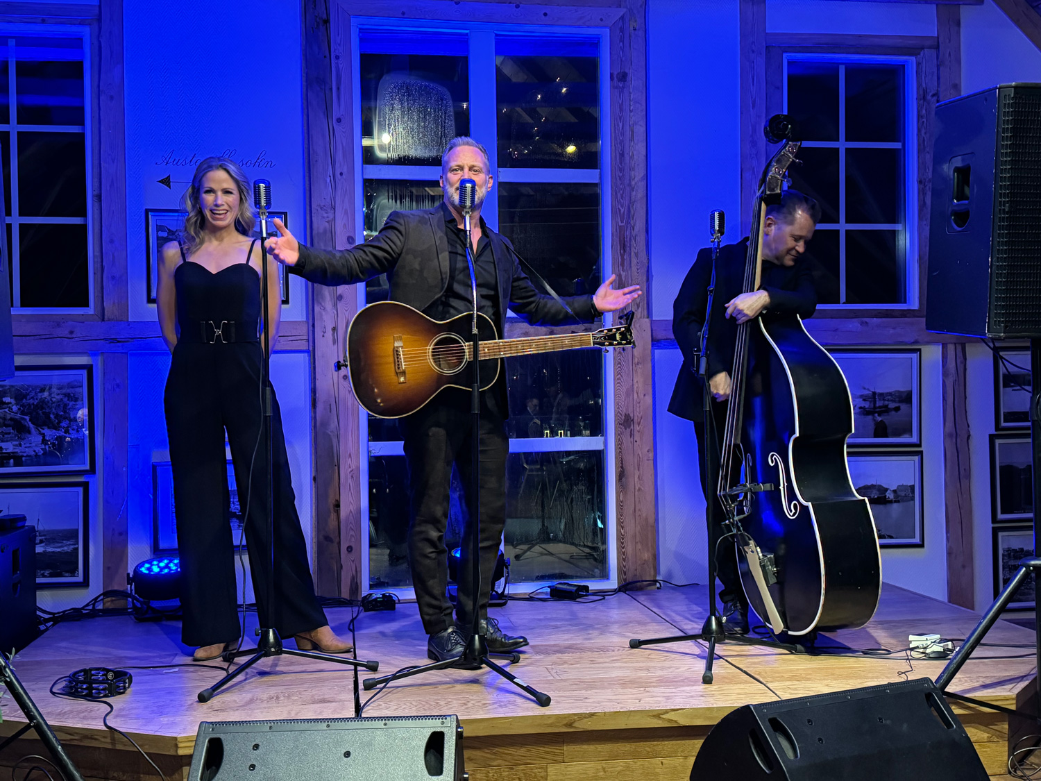 a group of people on a stage with musical instruments