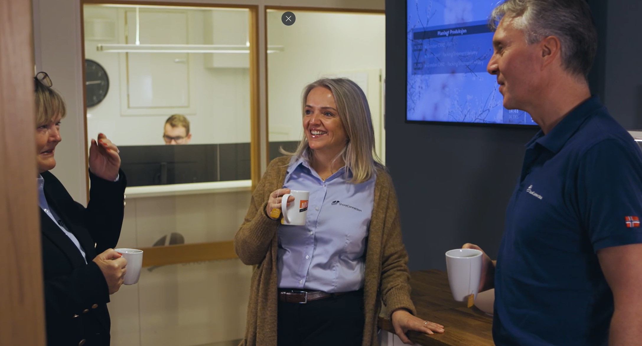 a woman holding a cup