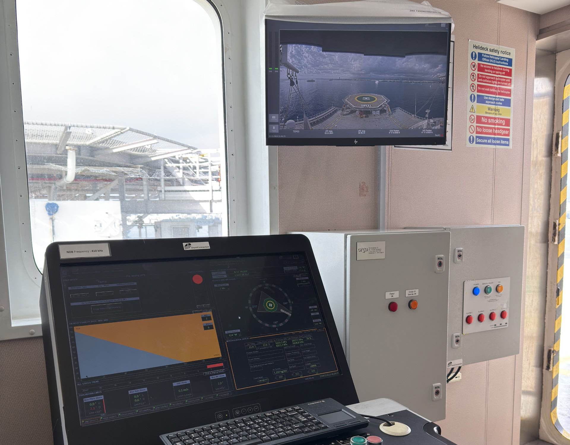a computer screen and monitor in a room